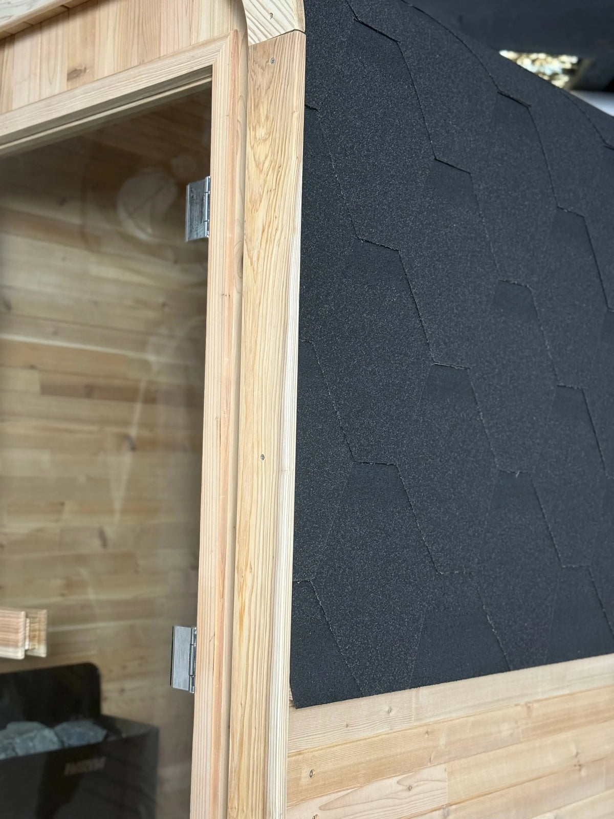 cube sauna upclose of roof shingles