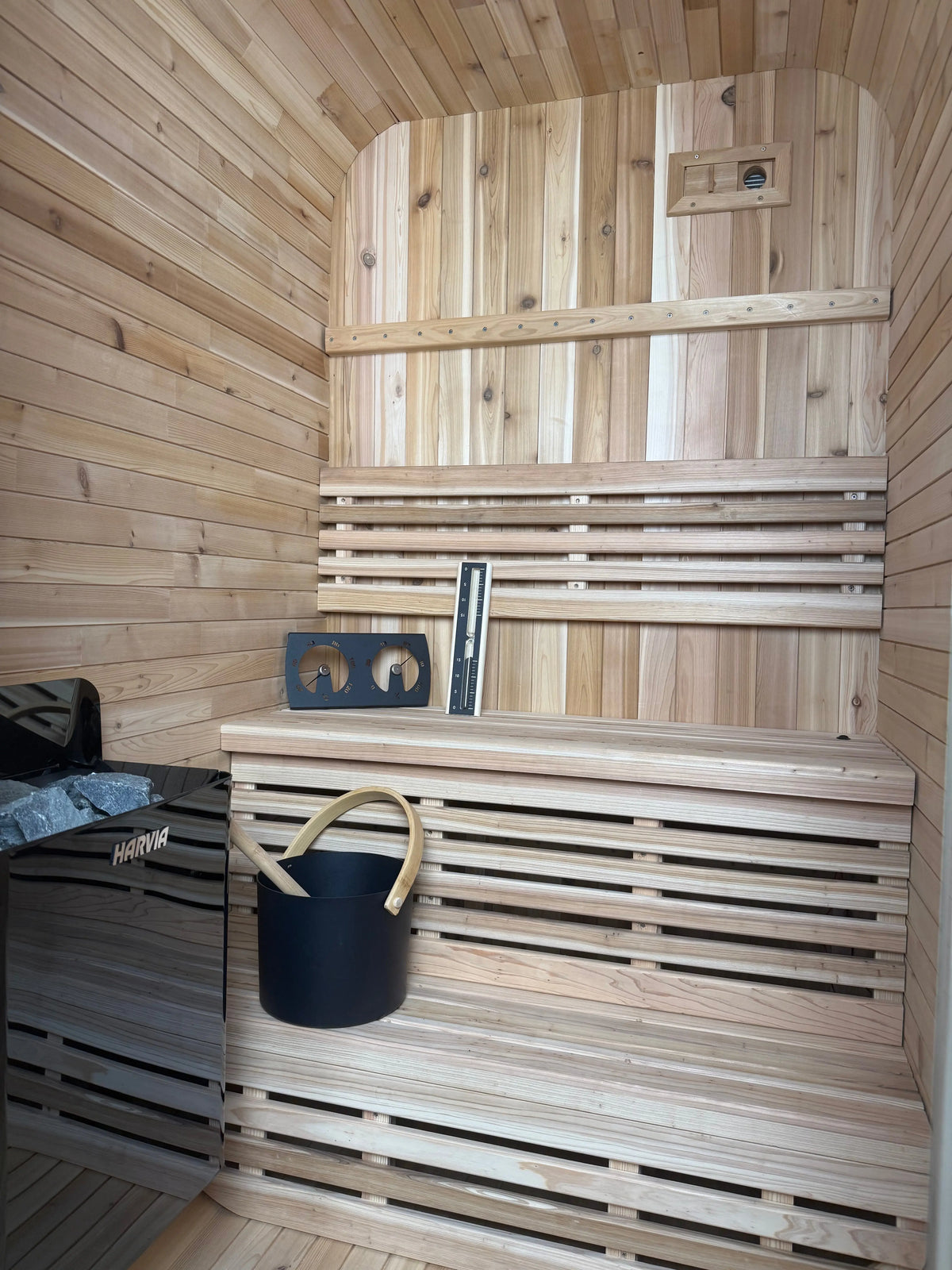 cube sauna inside, hygrometer kit on steps